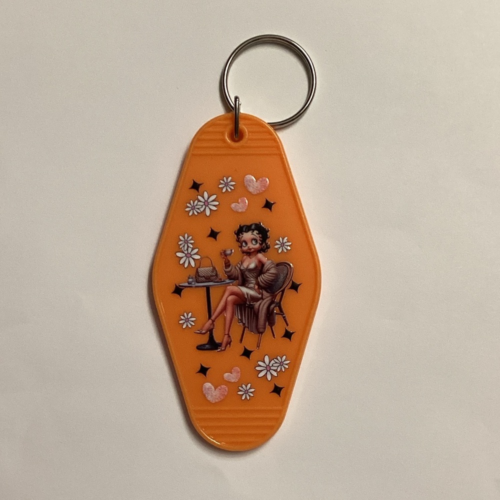 Orange Keychain with Cartoon Design